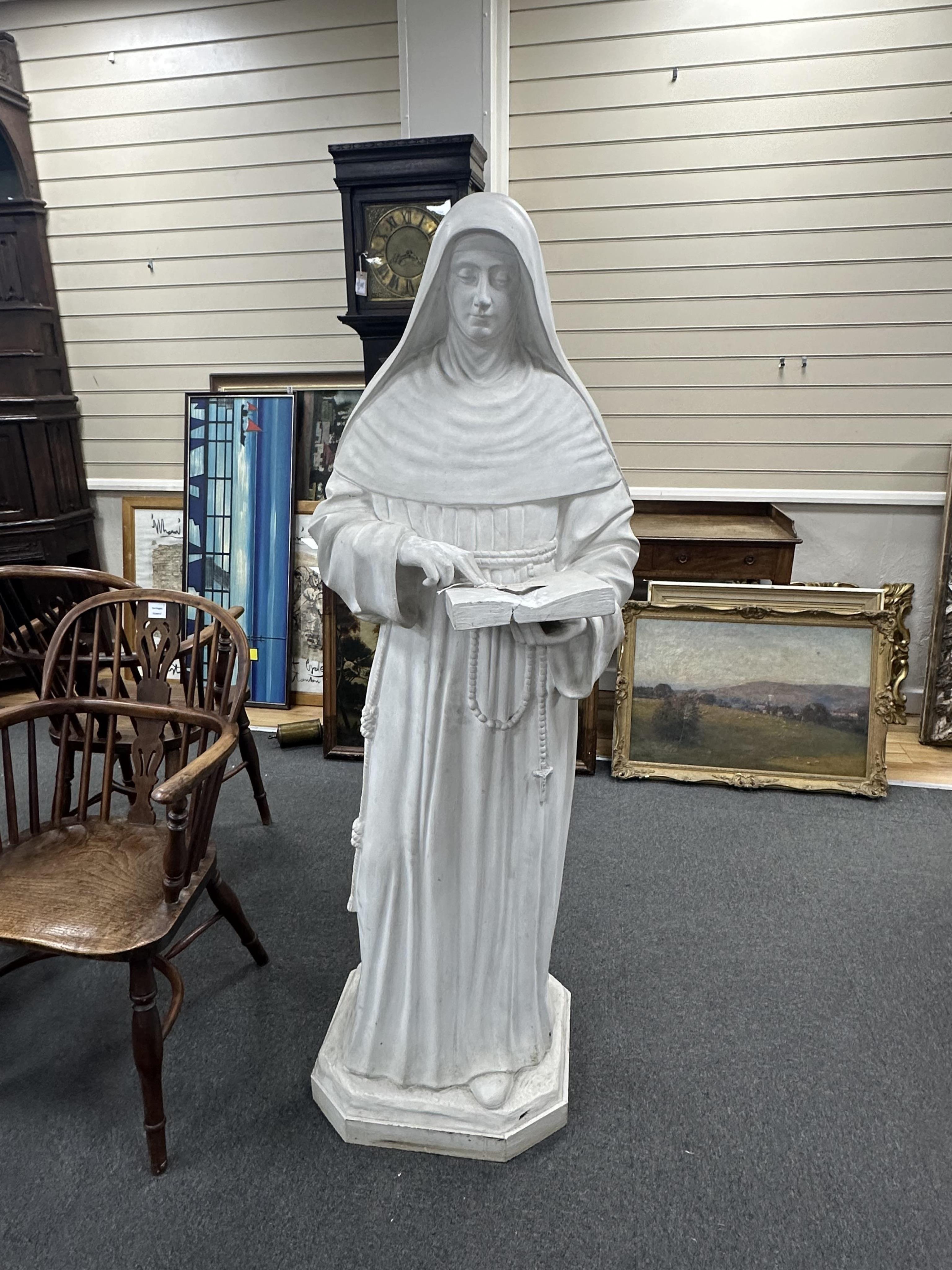 A late 19th/early 20th century life sized figure of a standing nun holding a book, height 158cm. Condition - poor to fair